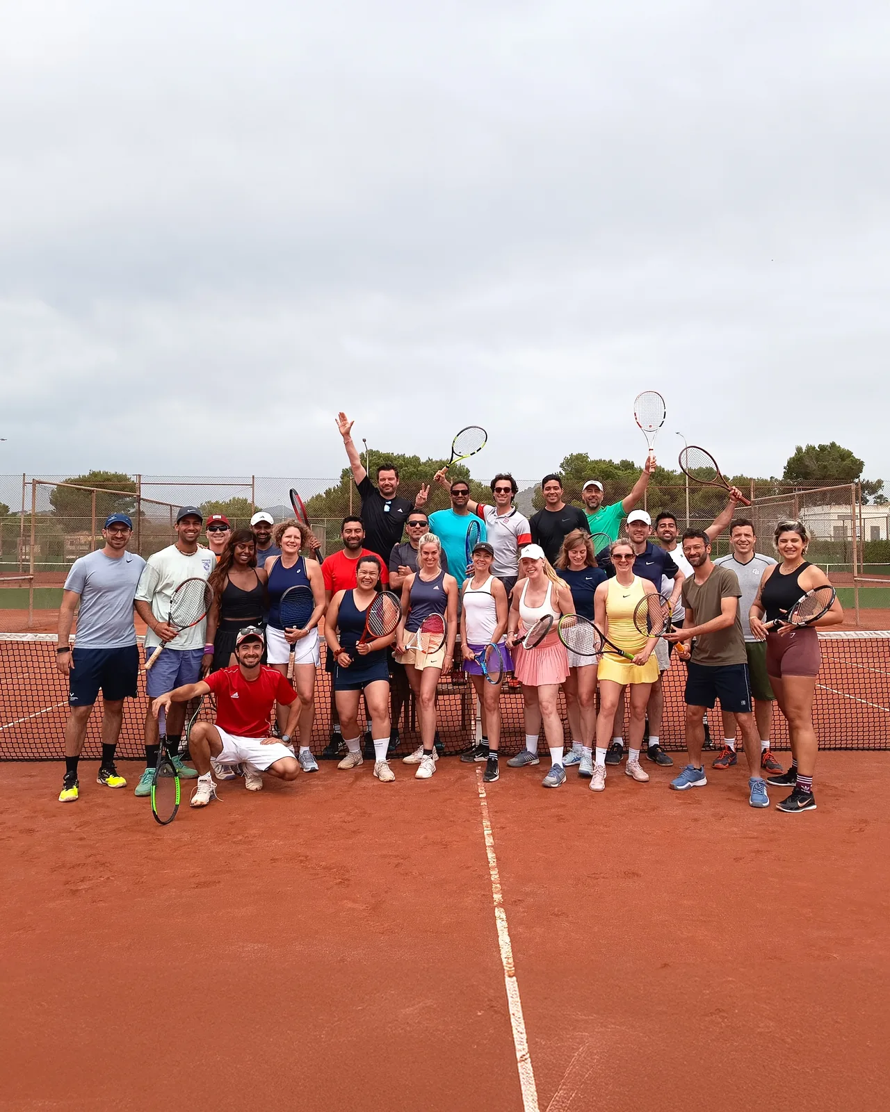 A large Red Clay group on court